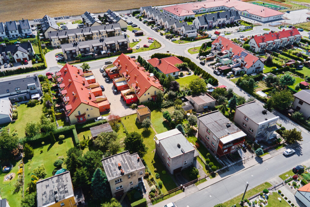 A view of a residential area with similar structures, which has an impact on exterior home painting.