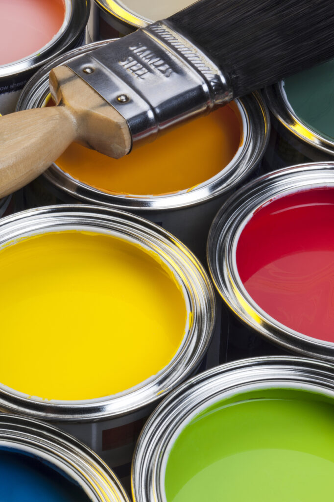 Cans of paint used by contractors for exterior painting near me.