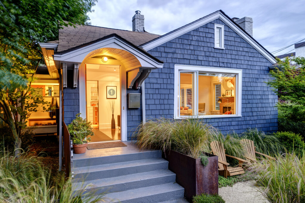 A blue house painted by professional residential painters.