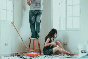 A couple who has decided to go the DIY route, after analyzing the cost of interior house painting.
