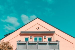 A house painted coral pink by a Wichita summer paint contractor.