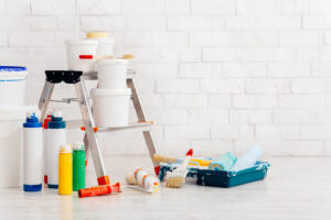 Tools to be used by a professional when painting a brick house.