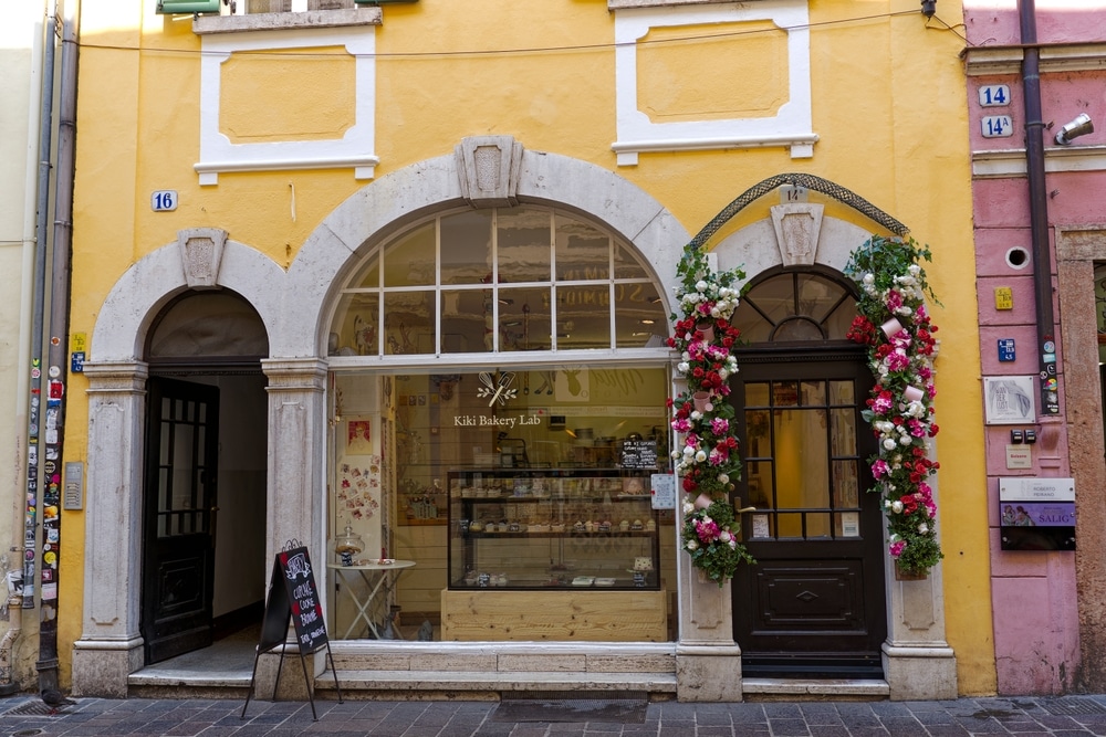 A store front painted yellow showcasing the impression commercial exterior painting has on visitors. 