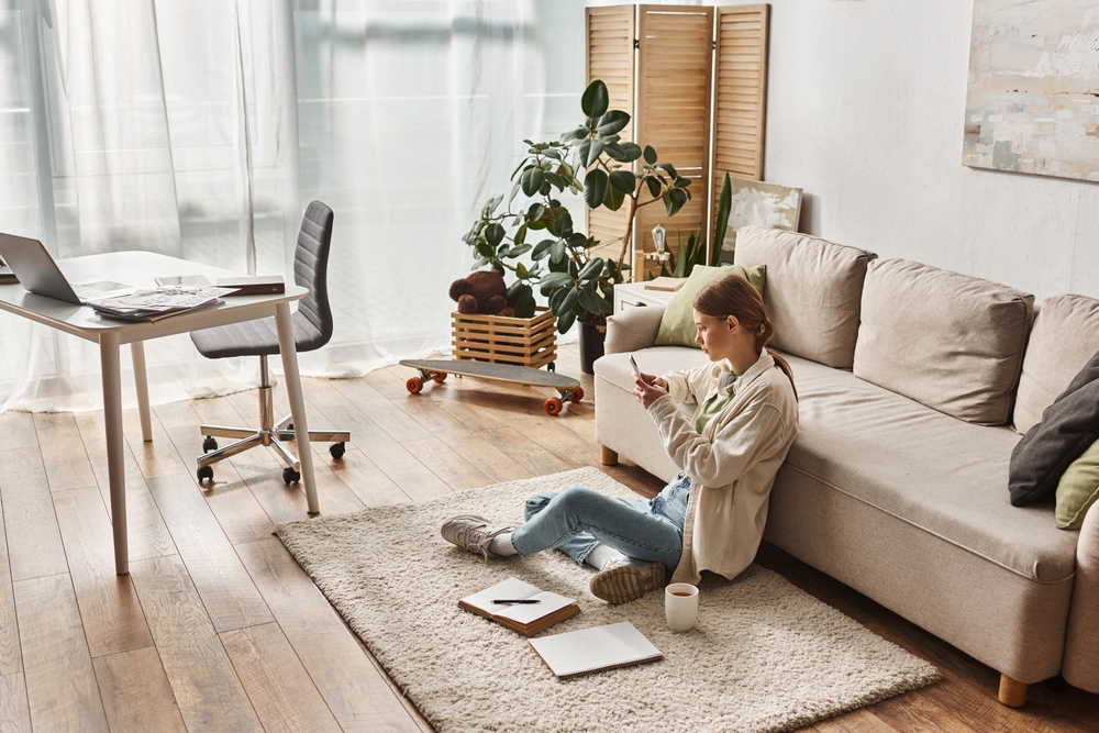 Modern home office with calm neutral colors palette, featuring beige tones, soft natural light, and minimalist furniture that create a peaceful and productive workspace atmosphere.
